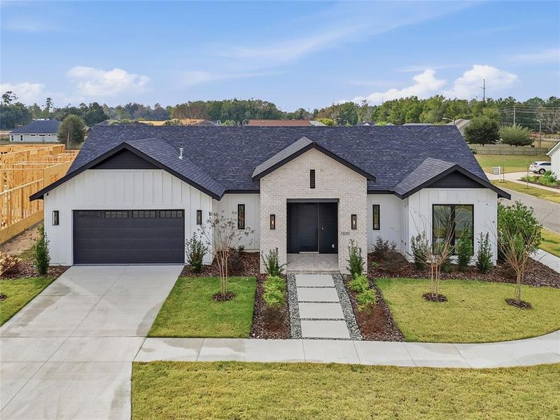 Front exterior of a new home in , Gainesville, FL, highlighting curb appeal (Image 22).