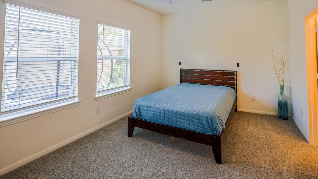 Furnished interior view inside a new home in Woodshore, Clute (Image 9).