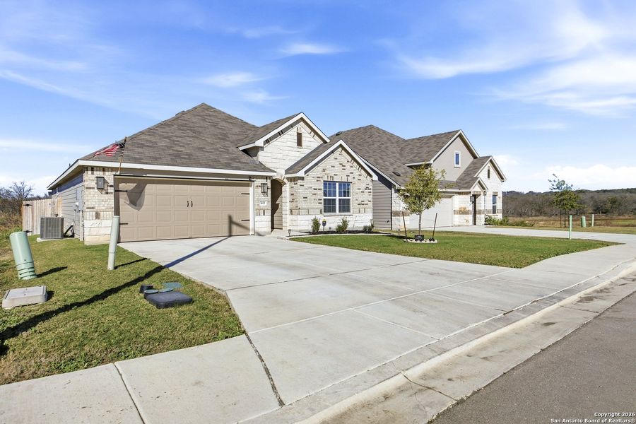 Front exterior of a new home in , New Braunfels, TX, highlighting curb appeal (Image 24).