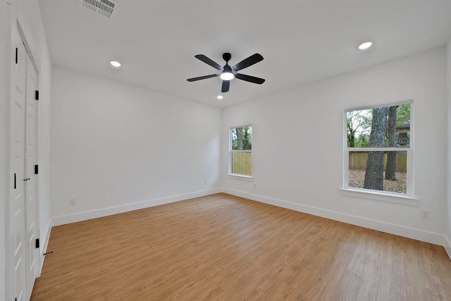 Unfurnished room with recessed lighting and light wood finished floors