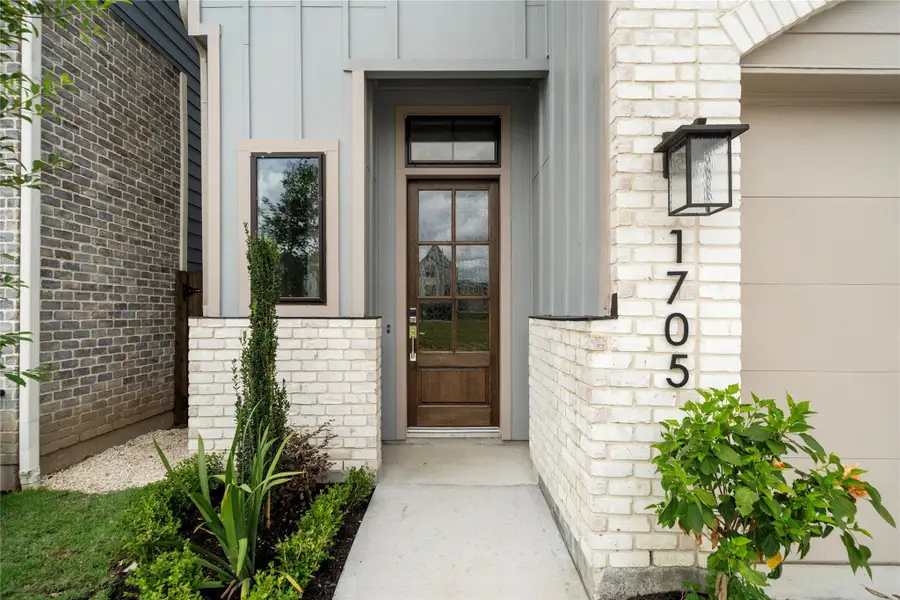 Front exterior of a new home in Spring Valley Creek, Houston, TX, highlighting curb appeal (Image 1). Front exterior of a new home in Spring Valley Creek, Houston, TX, highlighting curb appeal (Image 1).