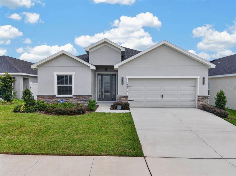 Front exterior of a new home in , Davenport, FL, highlighting curb appeal (Image 30).