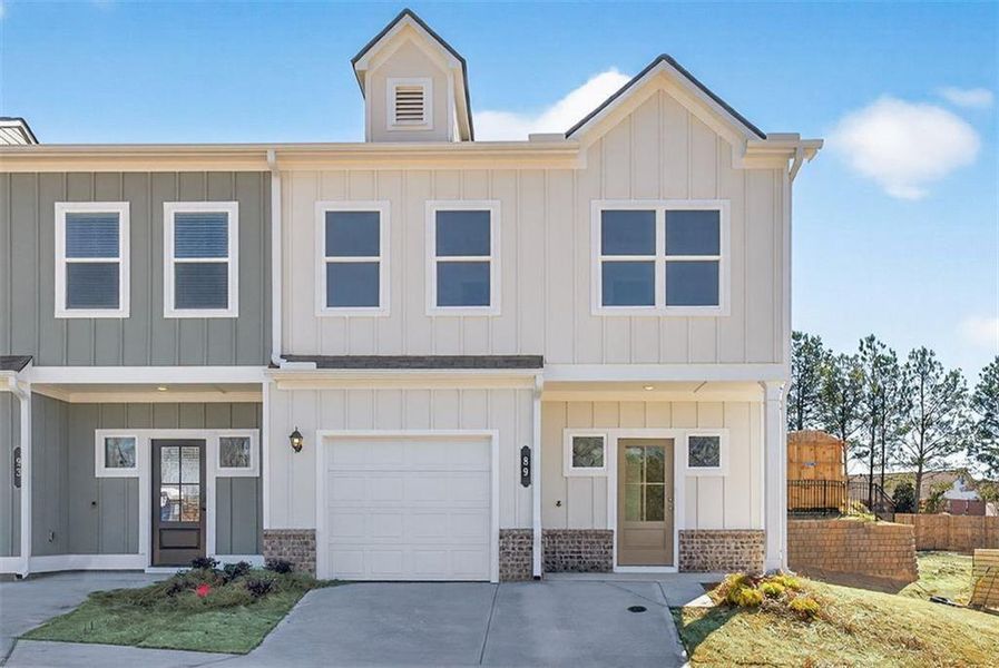 Front exterior of a new home in Fuller Station, Loganville, GA, highlighting curb appeal (Image 1). Front exterior of a new home in Fuller Station, Loganville, GA, highlighting curb appeal (Image 1).