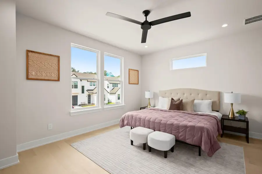 Bedroom featuring multiple windows, ceiling fan, recessed lighting, and light wood-type flooring