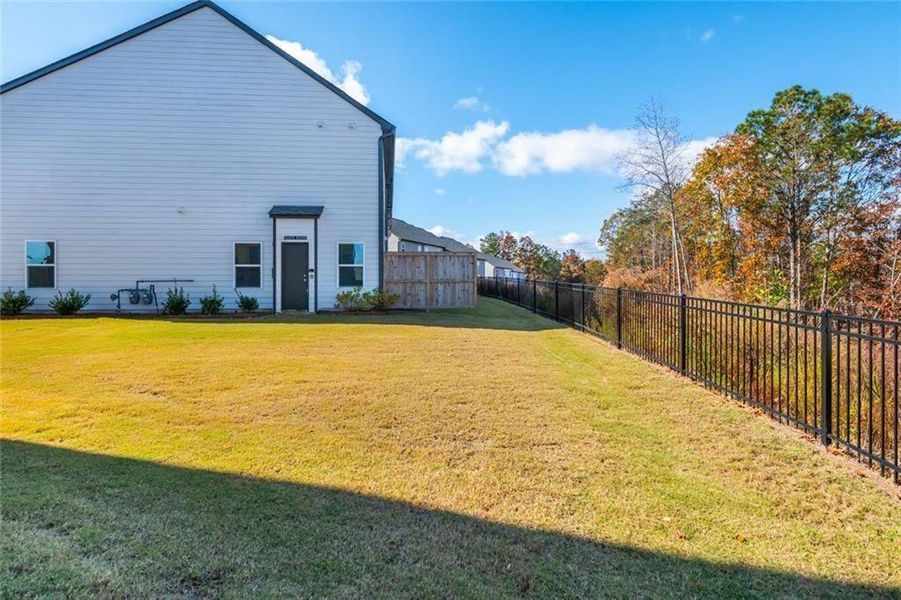 Exterior details and patio area of a home in Avignon - Townhomes, Cumming (Image 18). Exterior details and patio area of a home in Avignon - Townhomes, Cumming (Image 18).