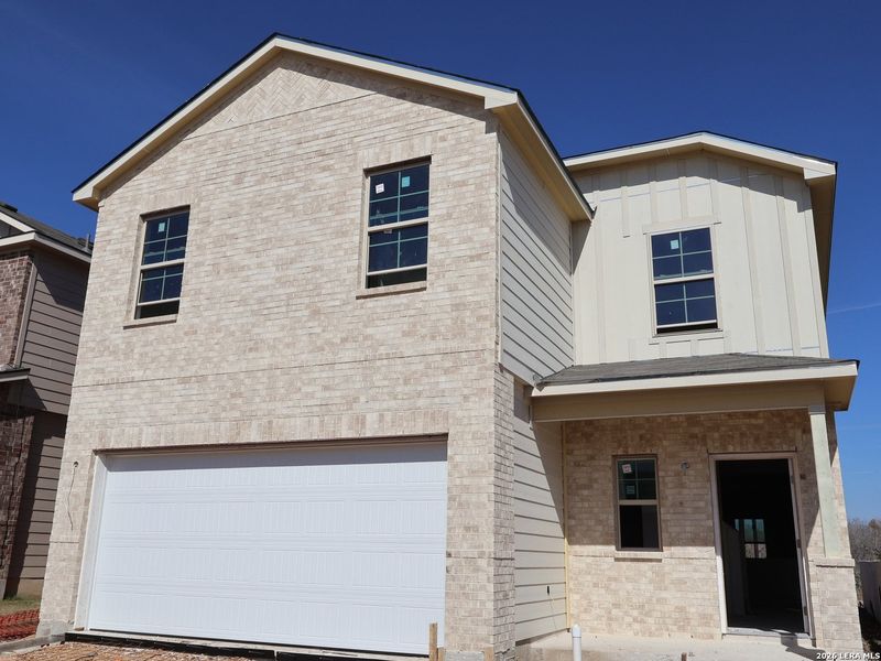Front exterior of a new home in Paloma Park, Converse, TX, highlighting curb appeal (Image 21).