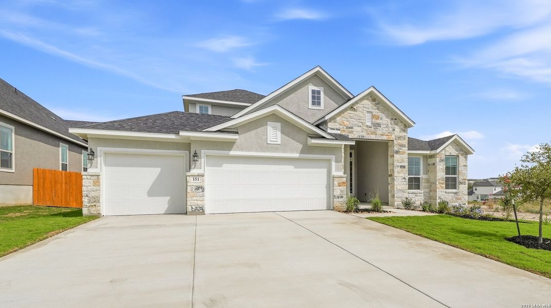 Front exterior of a new home in The Reserve at Potranco Oaks, Castroville, TX, highlighting curb appeal (Image 21). Front exterior of a new home in The Reserve at Potranco Oaks, Castroville, TX, highlighting curb appeal (Image 21).