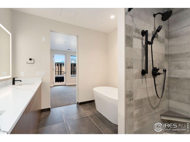 5 piece bathroom includes large walk in shower and stylish freestanding soaking tub