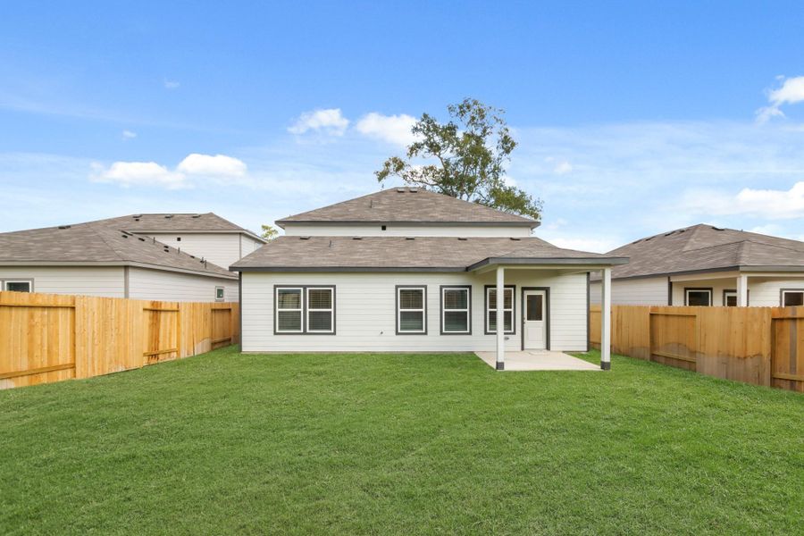 Exterior details and patio area of a home in Lakes at Crockett Martin, Conroe (Image 2).