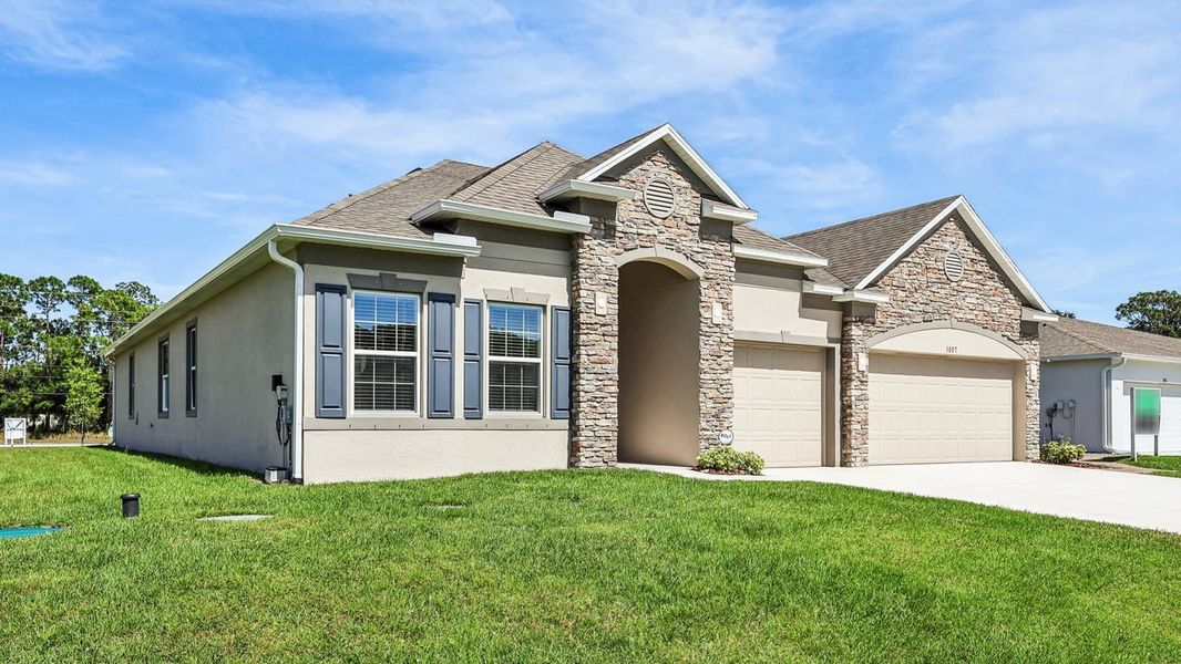 Representative exterior photo of a completed home built from the Venice by Maronda Homes in Malabar Springs, Palm Bay, FL (Image 21).