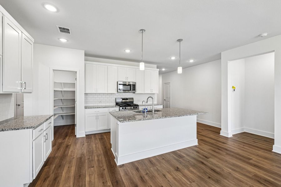 Furnished interior view inside a new home in Freedom at Anthem, Kyle (Image 6).