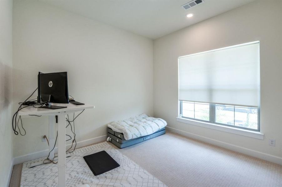 Carpeted bedroom featuring baseboards and recessed lighting Carpeted bedroom featuring baseboards and recessed lighting