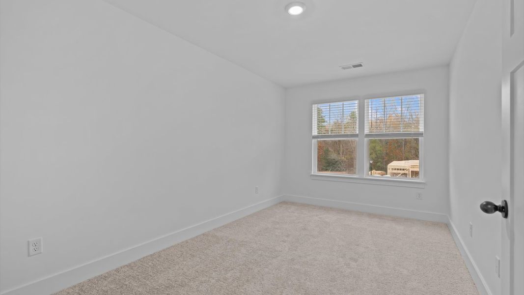 Vibrant and restful bedroom with oversized windows, refined detail, and a warm, welcoming atmosphere Vibrant and restful bedroom with oversized windows, refined detail, and a warm, welcoming atmosphere