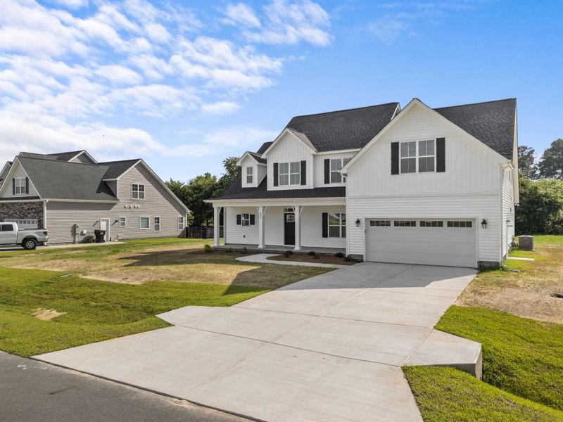 Representative exterior photo of a completed home built from the Albemarle by Bill Clark Homes in Kennedy's Crossing, Grimesland, NC (Image 25). Representative exterior photo of a completed home built from the Albemarle by Bill Clark Homes in Kennedy's Crossing, Grimesland, NC (Image 25).