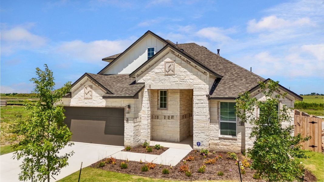 Front exterior of a new home in Highland Village, Georgetown, TX, highlighting curb appeal (Image 2).