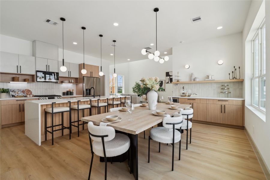 Warm woods, crisp whites, and bold accents create a modern aesthetic grounded in comfort and sophistication.