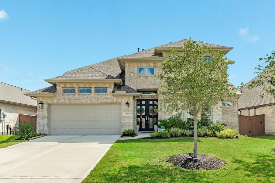 Exquisite 2-story Perry Home featuring a stunning all-brick and stone exterior, complemented by beautiful custom wooden and glass double front doors. Exquisite 2-story Perry Home featuring a stunning all-brick and stone exterior, complemented by beautiful custom wooden and glass double front doors.
