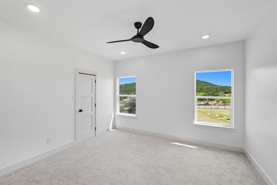 Spare room featuring carpet, ceiling fan, and recessed lighting Spare room featuring carpet, ceiling fan, and recessed lighting
