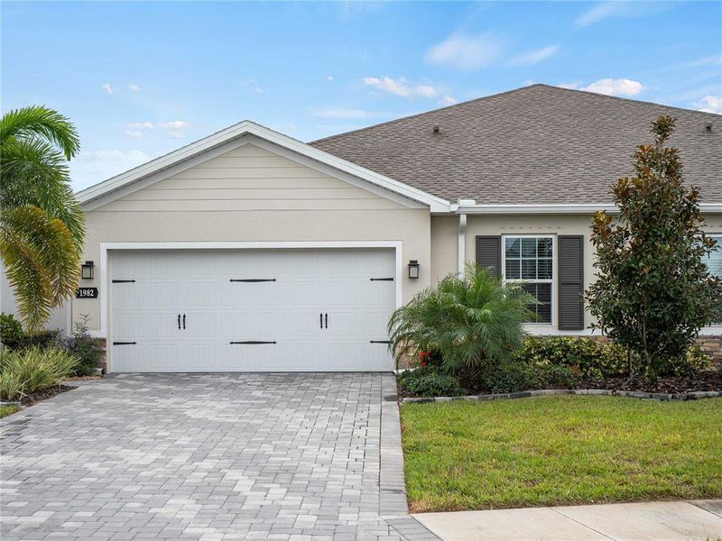 Front exterior of a new home in , Port Charlotte, FL, highlighting curb appeal (Image 2).