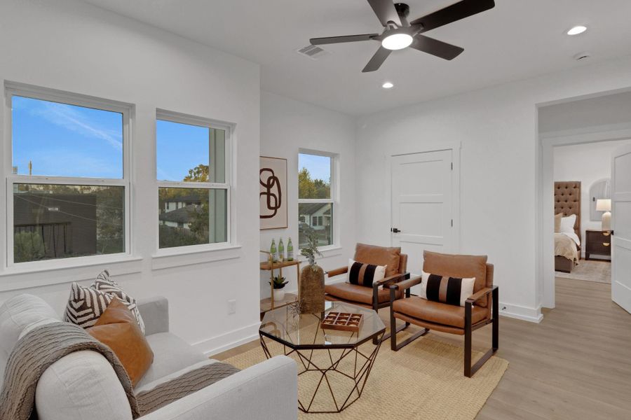 Versatile upstairs game room with abundant natural light—ideal for a second living area or playroom. Versatile upstairs game room with abundant natural light—ideal for a second living area or playroom.