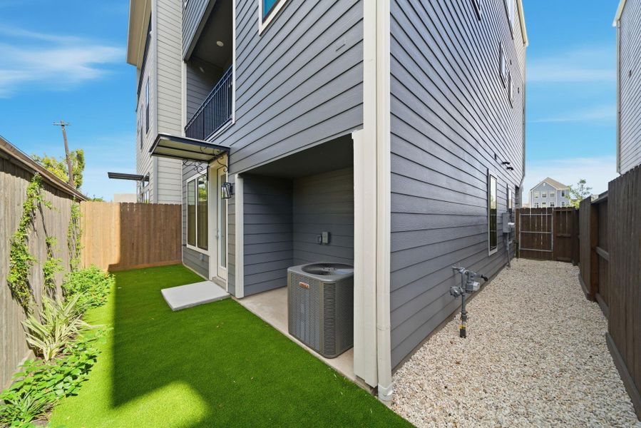 Exterior details and patio area of a home in Spring Valley Creek, Houston (Image 17).