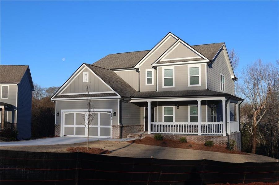 Front exterior of a new home in Calgary Downs, Winder, GA, highlighting curb appeal (Image 14).