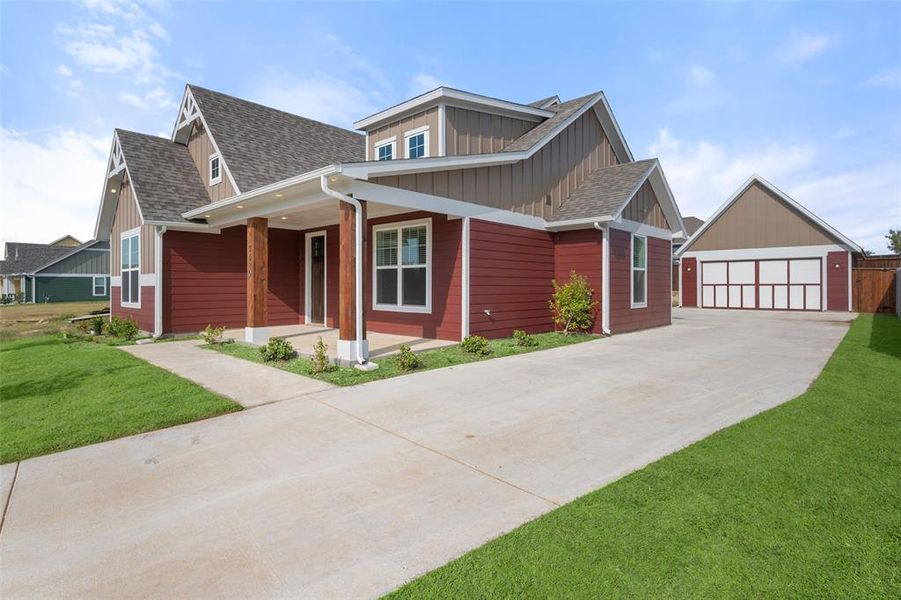 Side view of home with detached garage