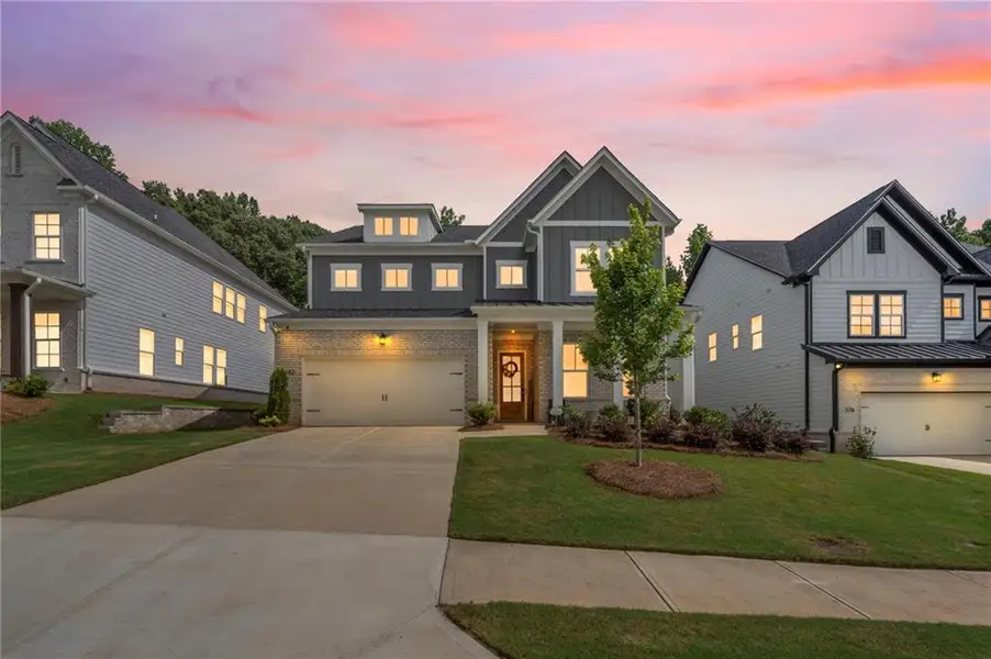 Front exterior of a new home in , Woodstock, GA, highlighting curb appeal (Image 1). Front exterior of a new home in , Woodstock, GA, highlighting curb appeal (Image 1).