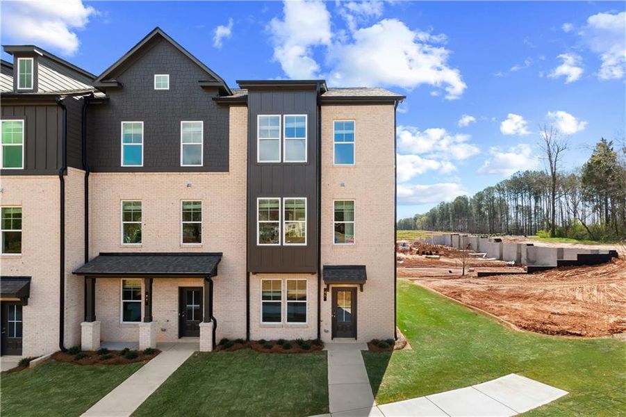Front exterior of a new home in Daybreak, Newnan, GA, highlighting curb appeal (Image 2). Front exterior of a new home in Daybreak, Newnan, GA, highlighting curb appeal (Image 2).