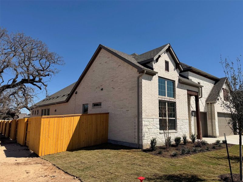 Exterior details and patio area of a home in Oaks at San Gabriel, Georgetown (Image 21).