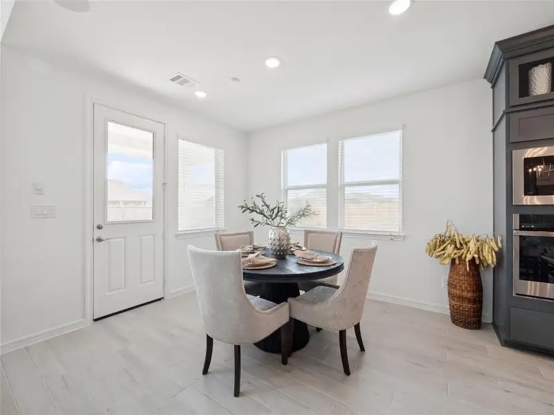 Sun-lit dining area (*Photo not of actual home and used for illustration purposes only.)