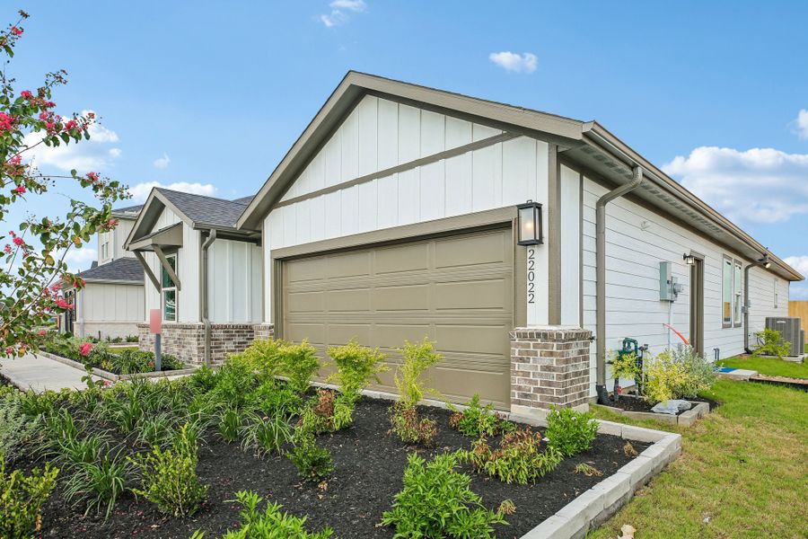 Representative exterior photo of a completed home built from the Charlton by Taylor Morrison in Mason Woods, Cypress, TX (Image 23).