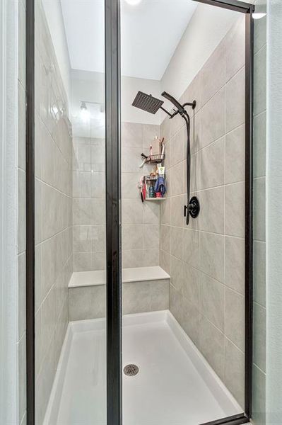 Bathroom with a shower with door