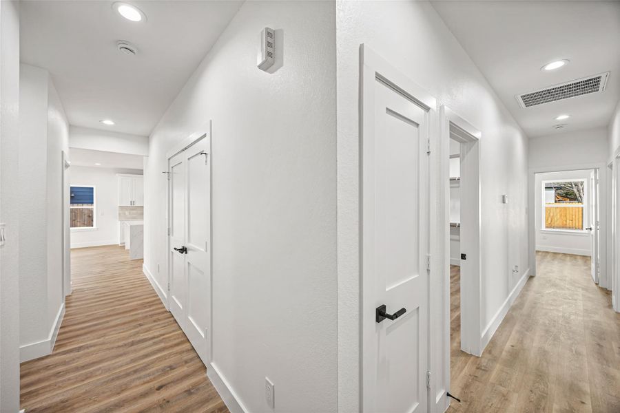 Wide hallway layout providing access to bedrooms and main living areas.