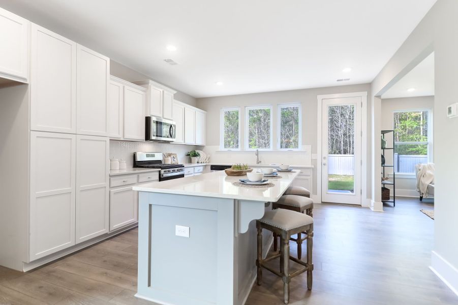 Representative furnished interior of a home built from the Inverness P by True Homes in Homecoming, Ravenel (Image 3).