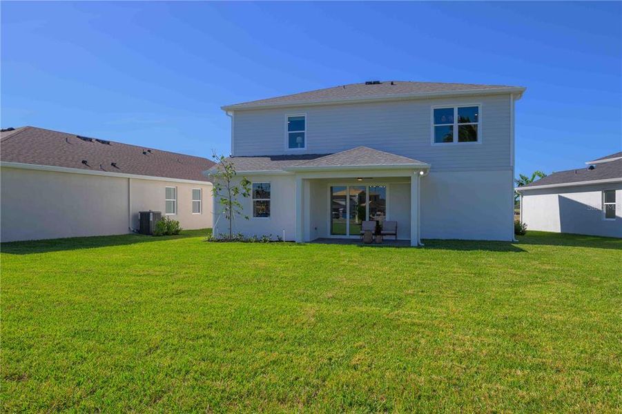 Exterior details and patio area of a home in Brystol North at Wylder, Port St. Lucie (Image 3).