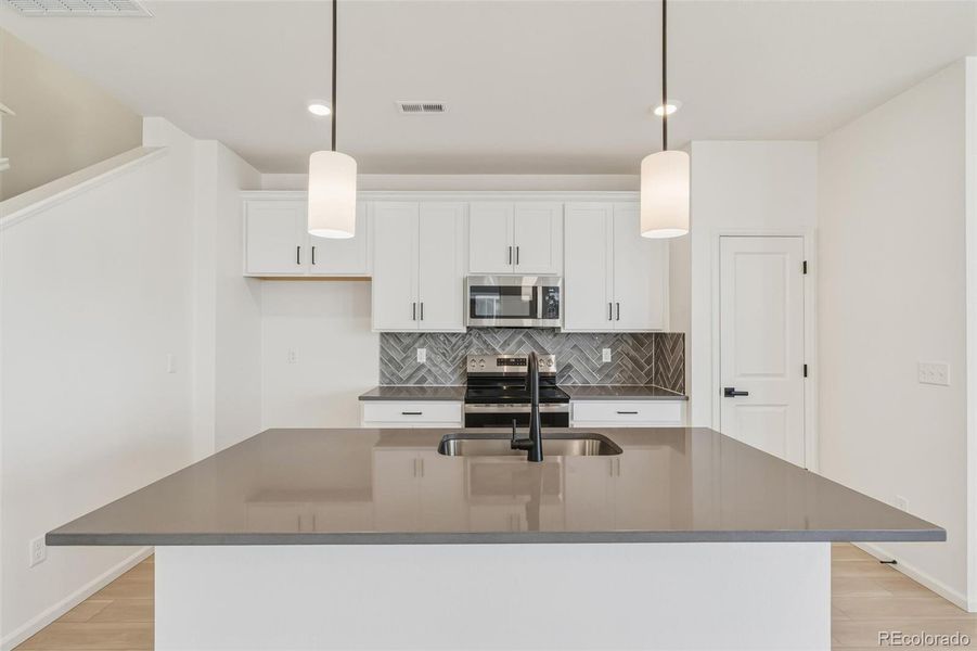 Furnished interior view inside a new home in Turnberry, Commerce City (Image 14).