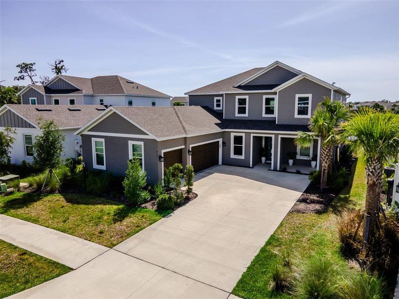 Front exterior of a new home in , Sarasota, FL, highlighting curb appeal (Image 23). Front exterior of a new home in , Sarasota, FL, highlighting curb appeal (Image 23).