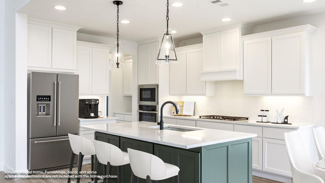 Kitchen featuring appliances with stainless steel finishes, white cabinets, recessed lighting, a kitchen island with sink, and light stone countertops