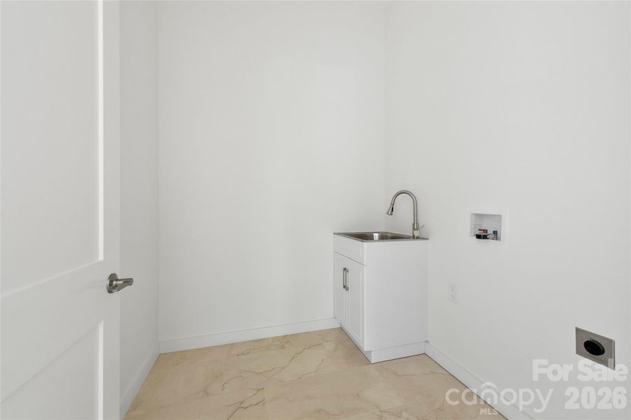 Dedicated laundry room with sink Dedicated laundry room with sink