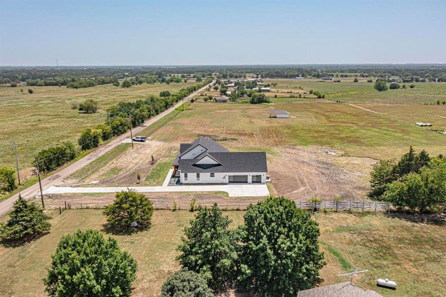 Birds eye view of property with a rural view