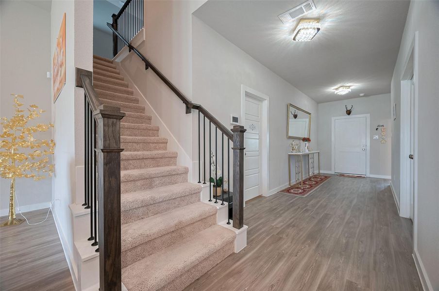 Staircase and open foyer view.