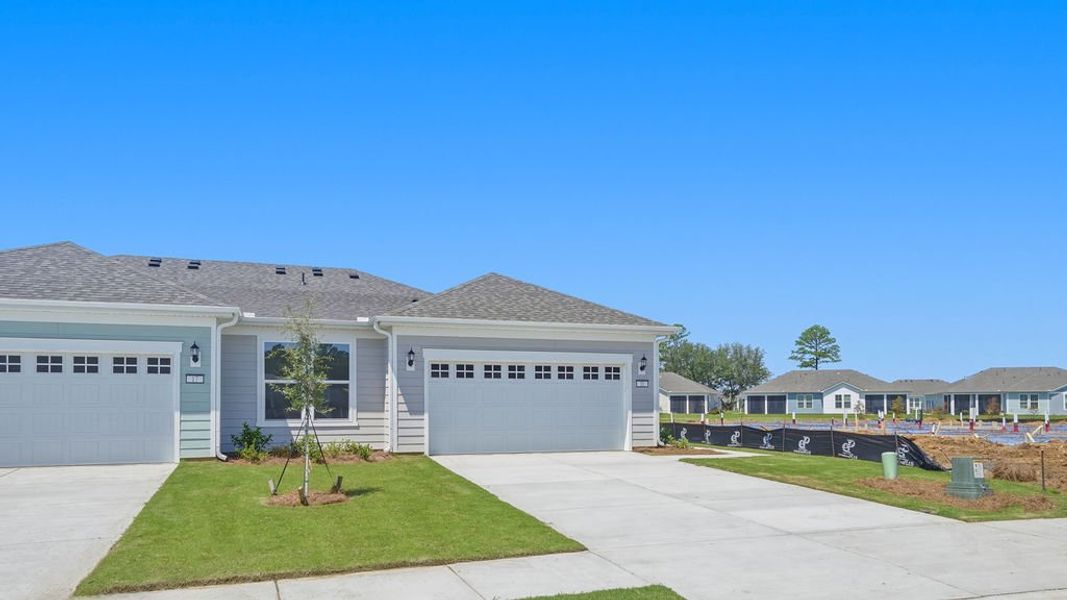 Front exterior of a new home in Sun City Hilton Head, Bluffton, SC, highlighting curb appeal (Image 25).