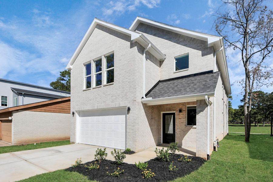 Front exterior of a new home in , Montgomery, TX, highlighting curb appeal (Image 2).