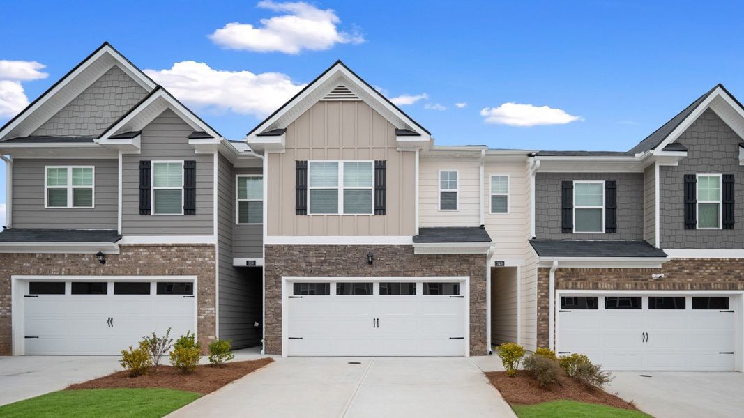 Front exterior of a new home in Inverness at Sugarloaf, Lawrenceville, GA, highlighting curb appeal (Image 1). Front exterior of a new home in Inverness at Sugarloaf, Lawrenceville, GA, highlighting curb appeal (Image 1).