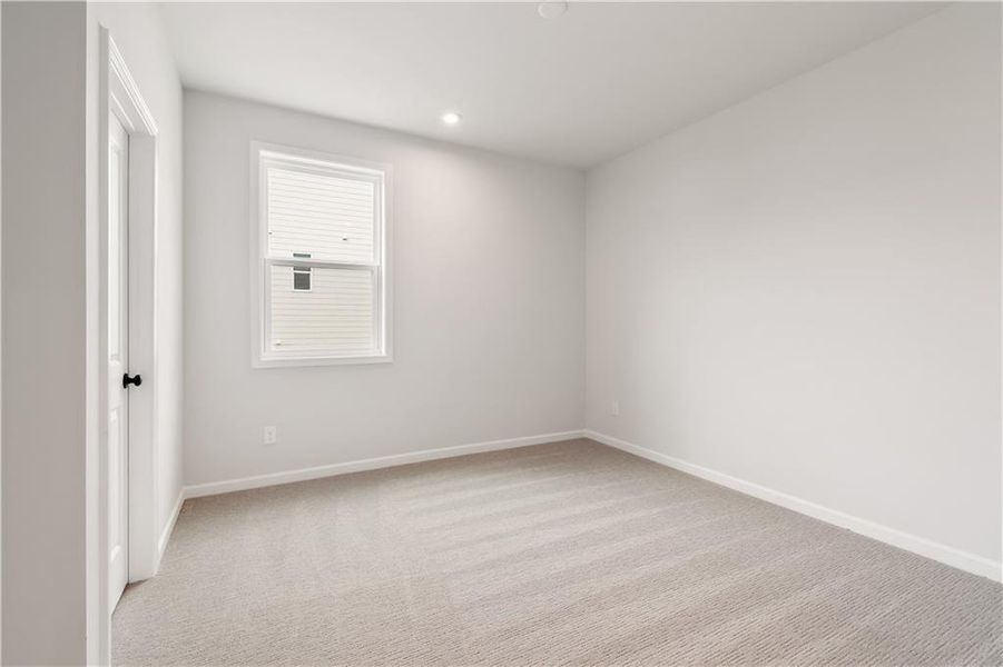 Spacious, unfurnished interior of a new home in The Paddocks at Doc Hughes, Buford (Image 26).