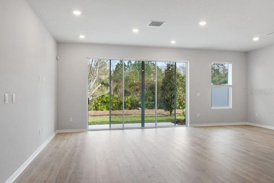 Family & Dining Room **Photos are of a Similar Home