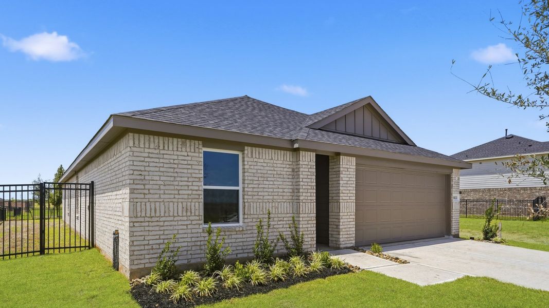 Front exterior of a new home in Sunterra, Katy, TX, highlighting curb appeal (Image 17).