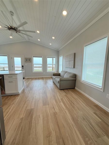 Back to living area with lovely updated lighting and vaulted ceiling. Back to living area with lovely updated lighting and vaulted ceiling.