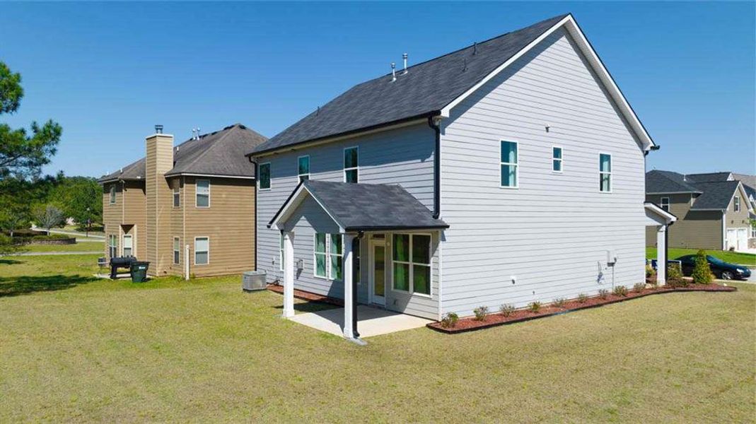 Exterior details and patio area of a home in Wildwood, Covington (Image 27). Exterior details and patio area of a home in Wildwood, Covington (Image 27).